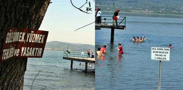 SAPANCA GÖLÜNDE İKİ FARKLI UYARI TABELASI